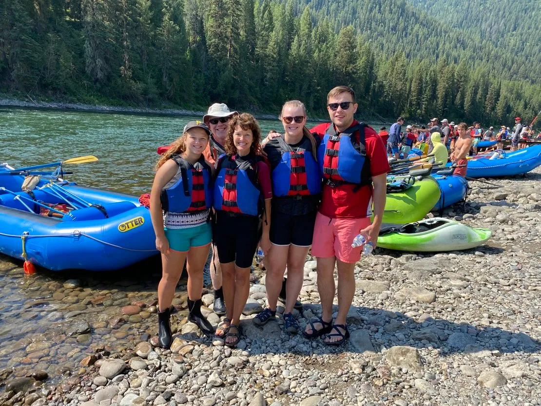 Group smiling before launch