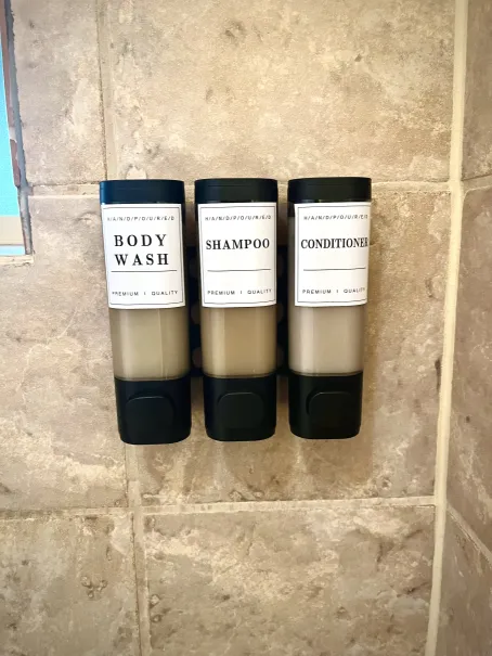 Shampoo, conditioner, and body wash provided in every shower