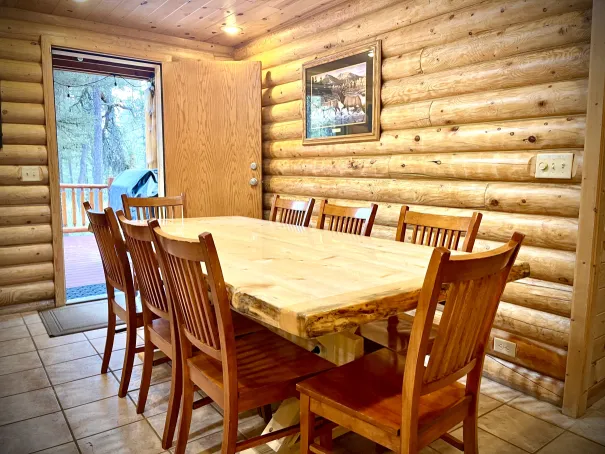 2.5-inch beetle-kill farm table crafted from a fallen tree right here on the property