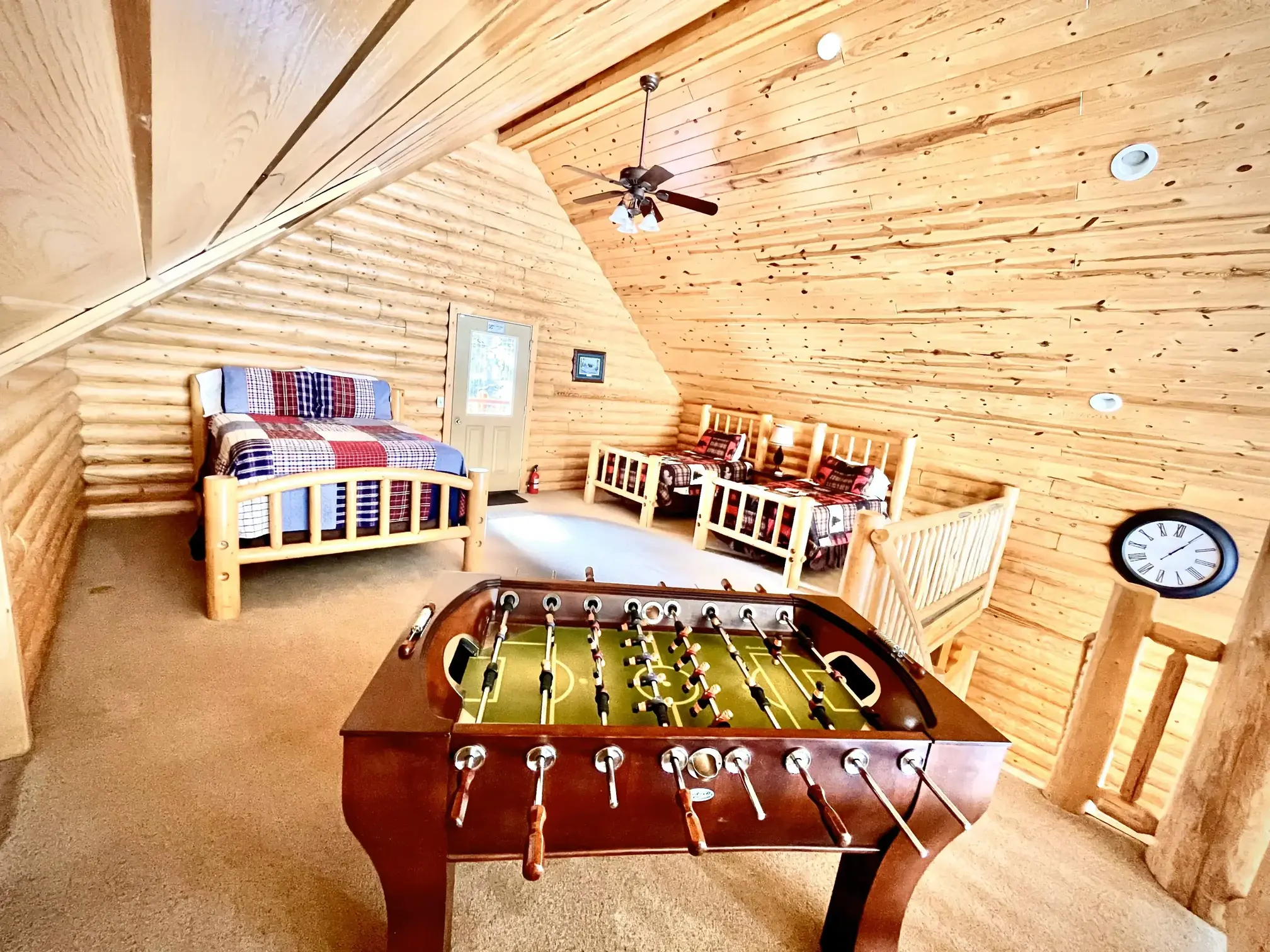 Another view of the loft area — beds and games