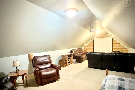 Bonus media room above the attached 2-car garage with a projector screen connected to Roku