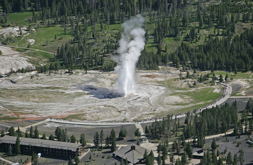 Aerial view of the Old Faithful boardwalk and Upper Geyser Basin with steam rising