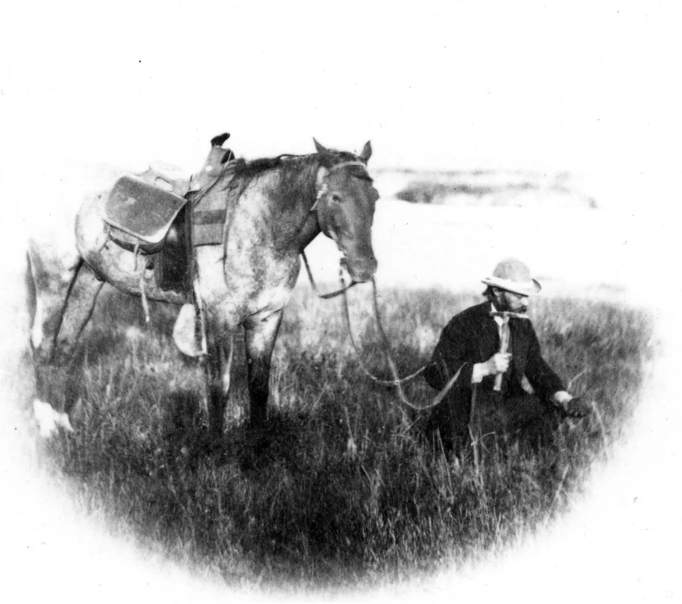 Ferdinand Hayden working with a rock hammer during geological fieldwork in 1870