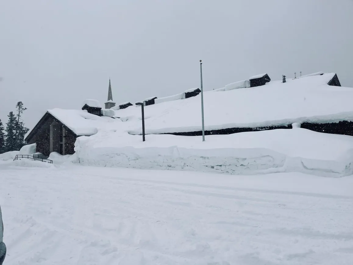 Church in Island Park with very high snow banks